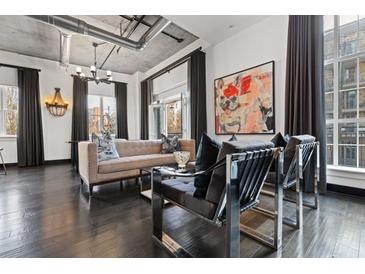 Spacious living room with comfortable seating and modern decor, perfect for relaxing or entertaining guests at 206 11Th Ne St # 205, Atlanta, GA 30309