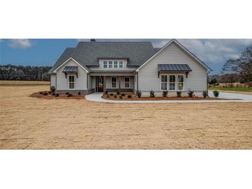 Beautiful single-story home with light gray siding, a gray roof, and a well-manicured lawn at 185 Paislee Park (Lot #10 Paislee Park) Dr, Fayetteville, GA 30215