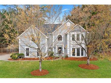 Charming two-story traditional home with gray siding, white trim, and manicured front yard at 3993 Amberley Ln, Marietta, GA 30062