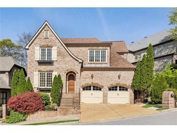 Charming brick home with a two-car garage, manicured landscaping, and inviting curb appeal at 1820 Buckhead Valley Ne Ln, Atlanta, GA 30324