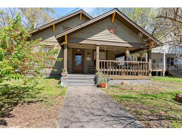 Charming craftsman home with a welcoming front porch, landscaped yard, and inviting curb appeal at 857 Dill Sw Ave, Atlanta, GA 30310