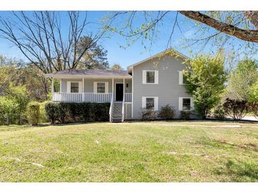Charming two-story home with a welcoming front porch and well-manicured lawn at 3582 Ontario Ct, Buford, GA 30519