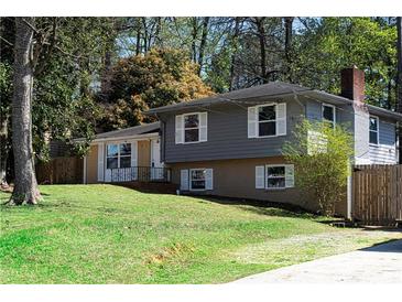 Charming two-story home with well-manicured lawn and classic architectural details at 2666 Frontier Trl, Atlanta, GA 30341