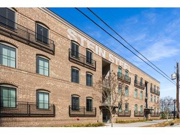 Beautifully restored brick building with black metal railings and large windows at 120 Beardon Se Cir # 2, Atlanta, GA 30316