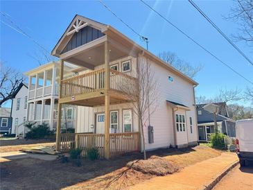 Charming two-story home featuring a double front porch perfect for enjoying the outdoors at 121 Thirkield Se Ave, Atlanta, GA 30315