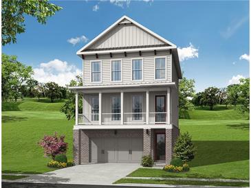 Charming two-story home features a covered porch and a brick facade with a garage at 655 Summit Hill Way, Cumming, GA 30040