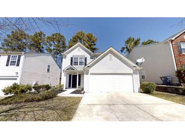 Charming two-story home with a well-maintained lawn and a classic white exterior at 3515 Devon Chase Rd, Atlanta, GA 30349