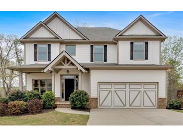 Charming two-story home with attached garage and well-manicured landscaping at 822 Pine Way, Dallas, GA 30157