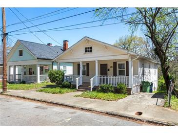 Charming craftsman-style home with inviting front porch and well-maintained landscaping at 900 Oakhill Sw Ave, Atlanta, GA 30310