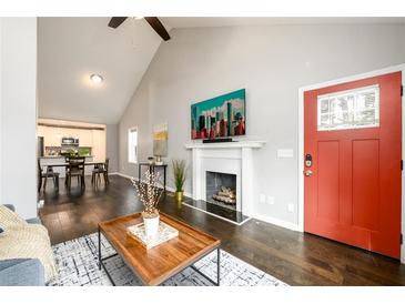 Bright living room features hardwood floors, fireplace, and an open floor plan at 2107 Penrose Dr, Atlanta, GA 30344