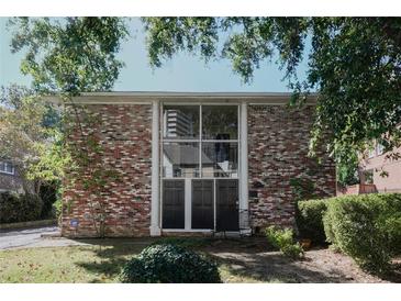 Charming brick multi-Gathering home with large windows and mature trees on a sunny day at 3668 Kingsboro Ne Rd # 6, Atlanta, GA 30319