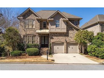 Beautiful brick home with a well-maintained front yard and a two-car garage at 4022 Newhaven Ne Cir, Brookhaven, GA 30319