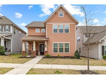 Charming two-story home featuring a well-manicured front yard and inviting curb appeal at 155 Concord Ct, Fayetteville, GA 30214
