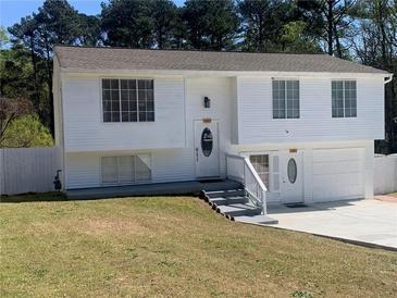 Charming two-story home with a well-manicured lawn and inviting entryway, creating a warm and welcoming curb appeal at 6308 Boyett Drive Dr, Norcross, GA 30093