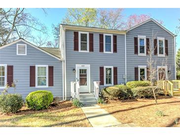 Charming two-story home with classic shutters and a well-manicured front yard at 403 Oak Harbor Ct, Marietta, GA 30066