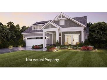 Charming single-Gathering home featuring a well-manicured lawn and attached two car garage at 3557 Fishpond Cir, Dacula, GA 30019