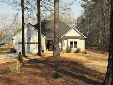 Charming one story home featuring an attached garage and a well-maintained front yard at 197 Buckhorn Dr, Temple, GA 30179