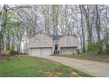 Charming two-story home featuring a two-car garage and a welcoming entrance at 3841 Greenbrook Dr, Douglasville, GA 30135