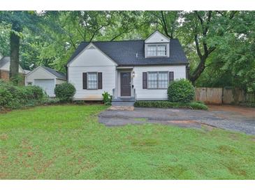 Charming two-story home with manicured lawn and inviting front entrance at 2344 Johnson Ferry Ne Rd, Atlanta, GA 30341