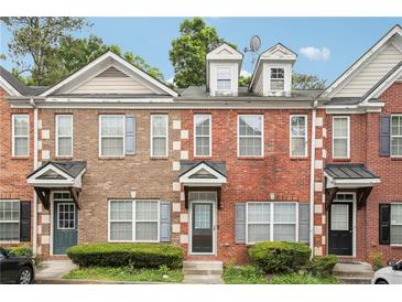 Charming brick townhome featuring a well-maintained facade and inviting front entrance at 2360 Johnson Rd, Atlanta, GA 30345