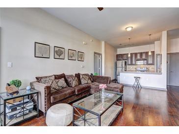 Inviting living room with hardwood floors and an open floorplan to the kitchen at 898 Oak Sw St # 1101, Atlanta, GA 30310