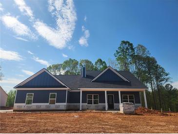 Charming new construction home with a covered front porch and craftsman-style details at 476 Benson Meadows Dr, Dallas, GA 30157