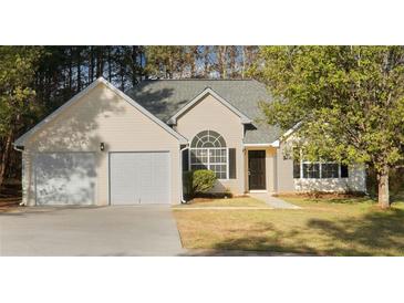 Charming single Gathering home with a two car garage, manicured lawn and delightful curb appeal at 4625 Thermal Ct, Douglasville, GA 30135