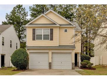 Charming two-story home featuring a two-car garage and a well-maintained lawn at 3417 Sable Chase Ln, Atlanta, GA 30349