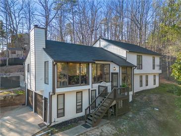 Charming two-story home with a front-facing garage and a well-maintained lawn at 1445 Bentcreek Dr, Marietta, GA 30062