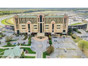 Expansive exterior view showcasing a modern condominium and surrounding parking area near the racetrack at 1500 Tara Pl # 709, Hampton, GA 30228