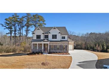 Beautiful new construction home featuring a brick and siding facade, manicured lawn, and paved driveway at 3816 Havenrock Drive, Marietta, GA 30066