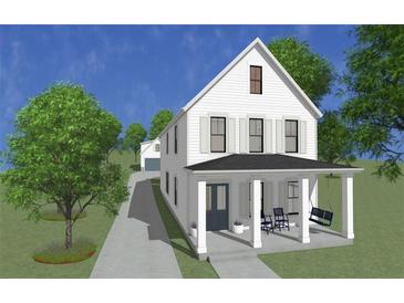 Charming two-story home featuring a covered porch, swing, and a well-maintained front yard with mature trees at 1091 Birch Sw St, Atlanta, GA 30310