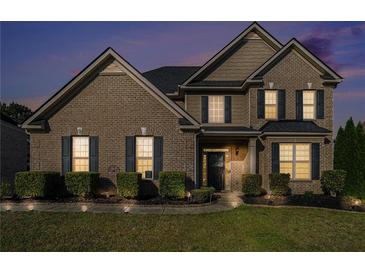 Charming two-story brick home featuring well-maintained landscaping and traditional architectural details at 508 Arbor Trl, Loganville, GA 30052
