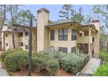 Inviting exterior view of a two-story condo with well-maintained landscaping at 810 Lismore Se # 10, Smyrna, GA 30080