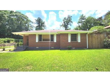 Charming brick home with a well-maintained lawn and a classic, inviting facade at 2213 Sharon Way, Decatur, GA 30032