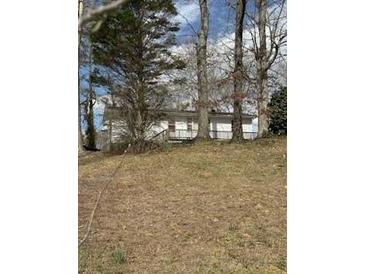 Charming home with mature trees and a well-maintained yard at 3944 Fairburn Rd, Douglasville, GA 30135