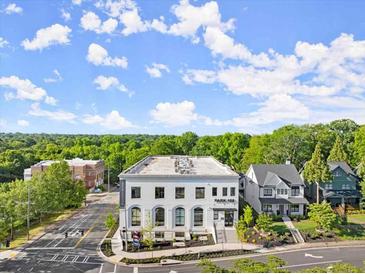 Exterior shot of a charming two-story building with a sign that reads PARK 108 at 108 Park Place Unit 104, Decatur, GA 30030