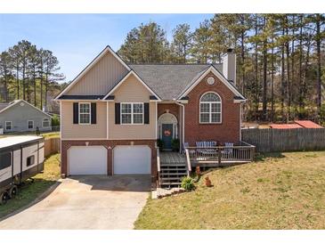 Charming two-story home with a combination of brick and siding, featuring a welcoming front porch at 248 Christian Circle, Carrollton, GA 30116