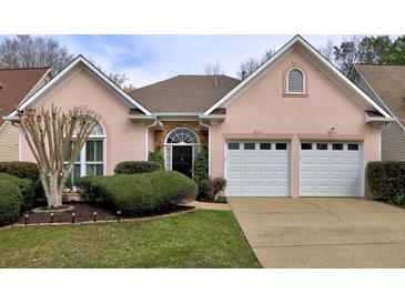 Charming single-story home featuring a well-manicured lawn, a two-car garage, and a welcoming entrance at 4103 Christacy Way, Marietta, GA 30066