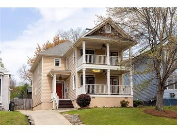 Charming two-story home featuring a double front porch, landscaped yard, and inviting curb appeal at 276 Atlanta Se Ave, Atlanta, GA 30315