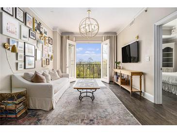 Inviting living room features balcony, elegant lighting, and stylish decor, creating a cozy atmosphere at 2277 Peachtree Rd # 503, Atlanta, GA 30309