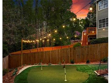 Backyard putting green with string lights for outdoor entertaining at 2015 Chelton Se Way, Smyrna, GA 30080
