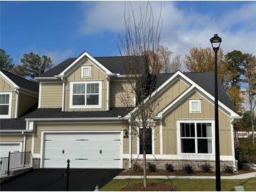New two-story home featuring an attached two-car garage, manicured lawn, and craftsman-style details at 1601 Bonica Xing # 1601, Cumming, GA 30040