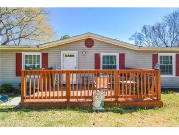 Charming home features a front porch, red shutters, and inviting curb appeal at 177 Carolyn Se Ct, Acworth, GA 30101