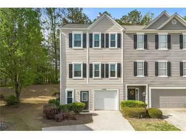 Charming townhome with well-maintained landscaping and attached garage, perfect for suburban living at 4306 Thorngate Ln, Acworth, GA 30101
