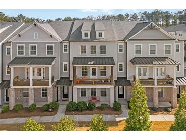 Charming townhomes with covered front porches, perfect for enjoying the outdoors at 2020 Rivermont Way, Roswell, GA 30076