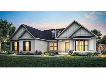 Charming single-story home with a brick facade, accentuated by modern design elements and lush landscaping at 2550 Bertrand Way, Cumming, GA 30041