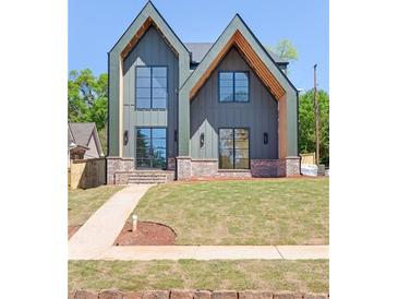 Stunning new construction with modern design elements and large windows at 504 Barrington Dr, Roswell, GA 30075