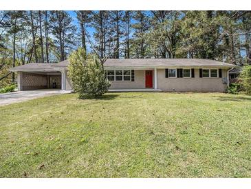 Charming one-story home with a red front door and a well-maintained lawn at , Decatur, GA 30035
