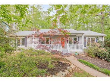 Charming single story home with a welcoming front porch and colorful garden at 2101 Kinridge Rd, Marietta, GA 30062